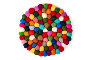 Colorful felt coaster, round shape, isolated on white background.