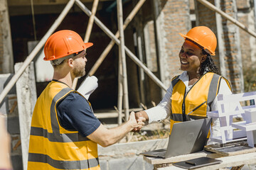 Engineer male handshake with contractor negotiate with partner dealing construction project success