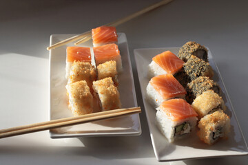 set of rolls and sushi with fish, breaded, rice, Japanese food, Japanese food delivery, bright...