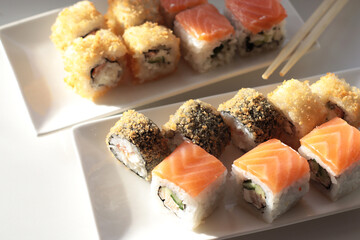set of rolls and sushi with fish, breaded, rice, Japanese food, Japanese food delivery, bright...