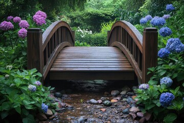 Wooden bridge crossing a stream in a peaceful garden with blooming hydrangeas