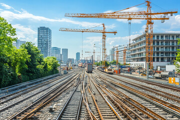 Fototapeta premium Industrial panorama with cranes and railway tracks
