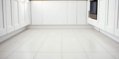 Fototapeta premium Clean white kitchen floor tiles beneath white cabinetry