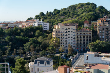 View of the upper neighborhoods of Barcelona in the morning. Typical and calm residential area in the Vallcarca district.