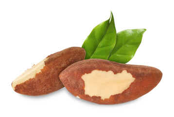 Brazil nuts and green leaves isolated on white