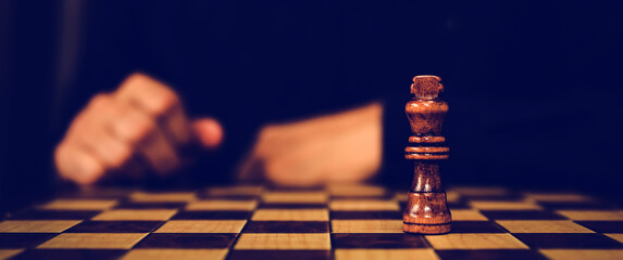 King chess standing on falling chess on the board for leadership or wining challenge and business...
