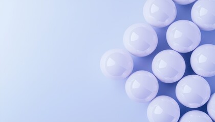 Fototapeta premium A close-up of white spheres arranged artistically against a light blue background, showcasing simplicity and elegance.