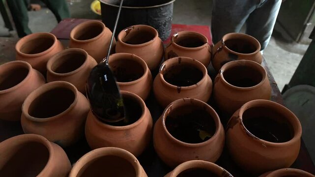 Filling of handi with mutton pieces prior to cooking. Hanid mutton recipe.
