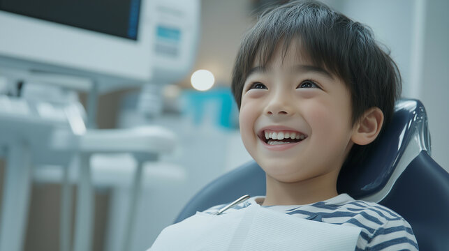 Little boy getting his teeth checked by dentist at dental clinic health care concept