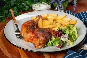 Appetizing baked chicken leg quarter.