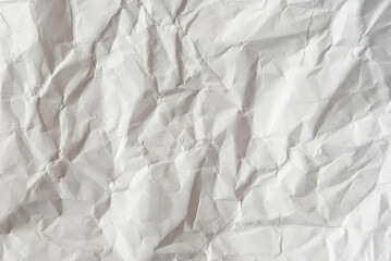 Obraz premium Textured white paper showing natural creases and folds.