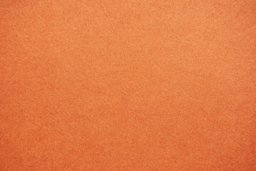 Bright orange paper surface ideal for design use.