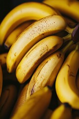 A pile of bananas on a podium against yellow background