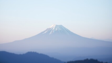 Serene Mountain Vista A Soft Focus Image of a Majestic Peak at Dawn