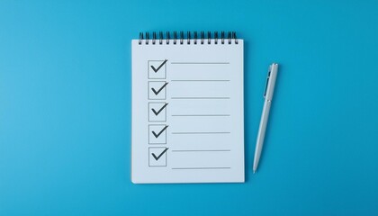 A blank notebook with a checklist being filled in and the last box being checked