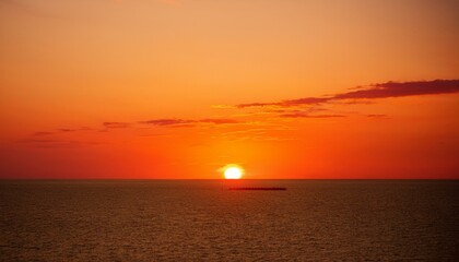 Fototapeta premium The point at which the temperature gradually drops in a bright orange sunset