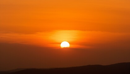 The point at which the temperature gradually drops in a bright orange sunset