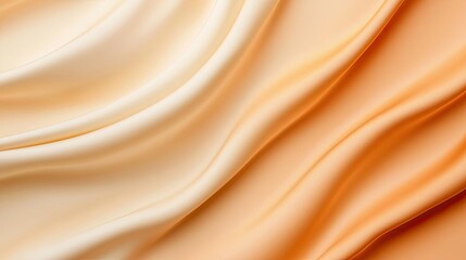 Velvet abstract background idea. A close-up of soft, flowing fabric in warm peach and cream tones, creating a smooth texture.
