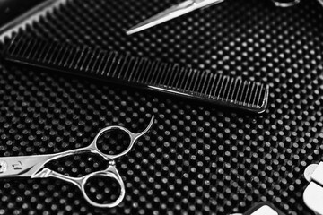Professional hairdressing tools arranged neatly on a styling workstation