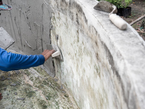Worker was Plastering The Wall of The Well