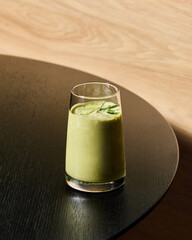 A Delightfully Refreshing Green Smoothie Beautifully Served on a Minimalist Table Setting