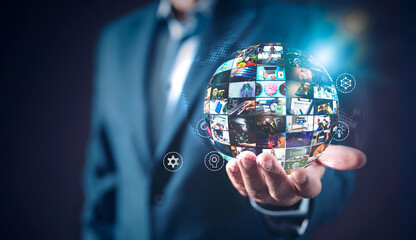 Man holding multimedia sphere, television concept