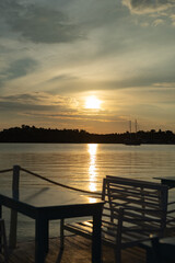Fototapeta premium sunrise on the sea coast, cafe on the coast