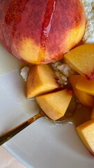 A close-up of a ripe peach half. A juicy fruit, symbolizing summer harvest and nature's taste.