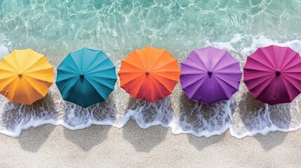 Naklejka premium Colorful beach umbrellas lining the shore