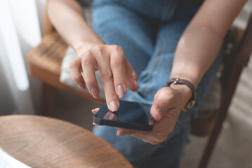 Close up of woman hand holding, using mobile phone for online shopping, digital payment via mobile banking app, social media, internet network, business and technology, people lifestyle