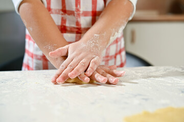 hands kneading dough