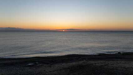 Drone aerial view of sea during sunrise