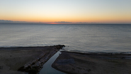 Drone aerial view of sea during sunrise