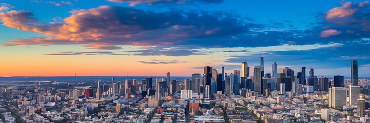 Obraz premium Panoramic Skyline of a Vibrant Modern City at Sunrise