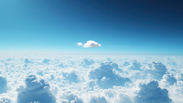Stunning view from above the clouds with a single cloud and a vibrant blue sky