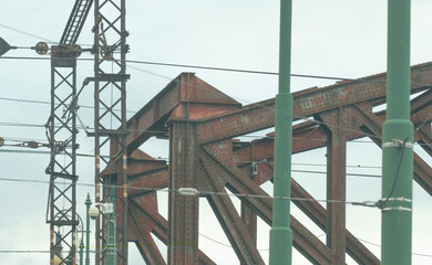 Bridge details, prominently displayed against a backdrop of a cloudy sky that adds atmosphere to the scene