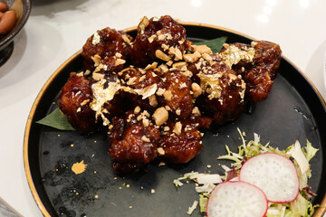 close up of Chinese Hong Kong Cantonese style deep fried pork ribs with Balsamic black vinegar
