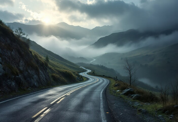 Naklejka premium A winding mountain road through a misty, hilly landscape with dramatic lighting and shadows