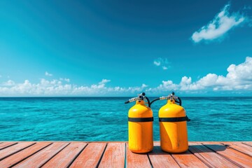 Scenic ocean view from a boat deck featuring bright yellow scuba tanks ready for exploration perfect for diving travel inspiration stock photography