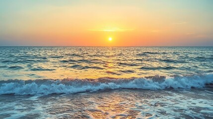 Obraz premium A serene sea at sunrise, with a colorful sky and glowing sunset. A peaceful beach landscape meets the horizon during quiet dusk and warm summer.