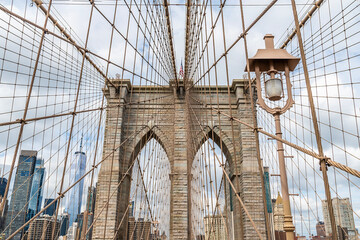 Fototapeta premium A view looking back towards the first support tower on the Brooklyn Bridge leaving Manhattan, New York, in the fall 