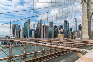 A view across the upper section of the Brooklyn Bridge towards the financial district in Manhattan, New York, in the fall