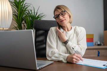 Happy smiling mature middle aged business woman, 40s professional lady executive manager talking on...