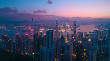 Fototapeta premium Vibrant Cityscape at Dusk with Illuminated Skyscrapers and Tranquil Harbor