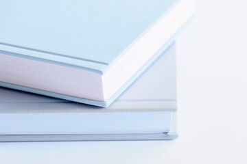 Stacks of pastel-colored books on a table