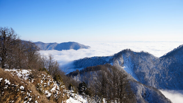 Amazing cloud formations over Gebele city at suset, surrounded by the Caucasus Mountains in early winter evening. Azerbaijan