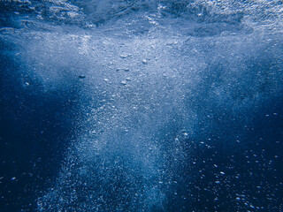 Air bubbles underwater rising to water surface, natural scene, bubbles under water, bubble undersea, sea in crystal clear green water. Real image very suitable for backgrounds, Great for background.