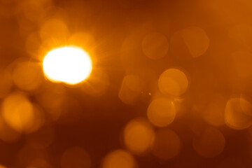 golden sunbeam sunlight beam sunshine sunset bright. Isolated yellow light rays animation. Shine or sun effect on black screen background. Glitter, shiny, bright, flare. orange sunrays, bokeh