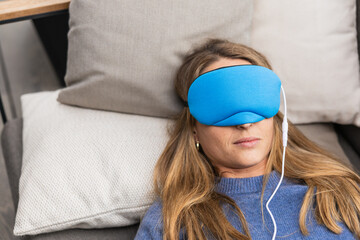 Woman relaxing with innovative temperature controlled sleep mask