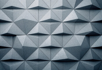 Obraz premium A geometric pattern of gray triangular shapes arranged in a repeating, angular design